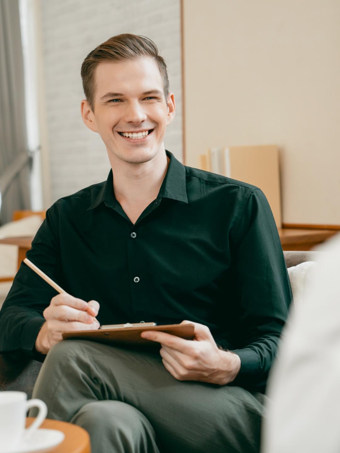 Psychologist smiling during session in mental health IOP in Colorado Springs.
