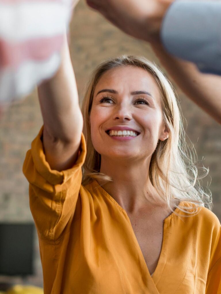 Woman smiling during group therapy in mental health IOP in Colorado Springs.