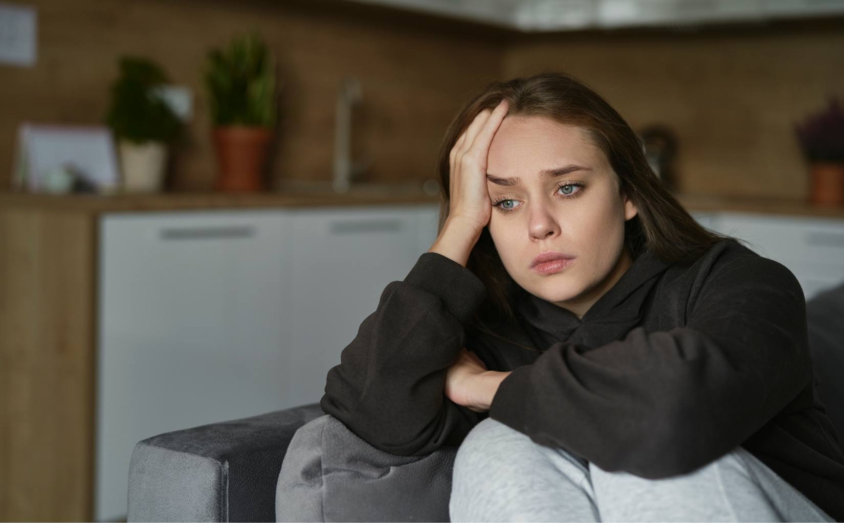 Individual appearing overwhelmed by anxiety.