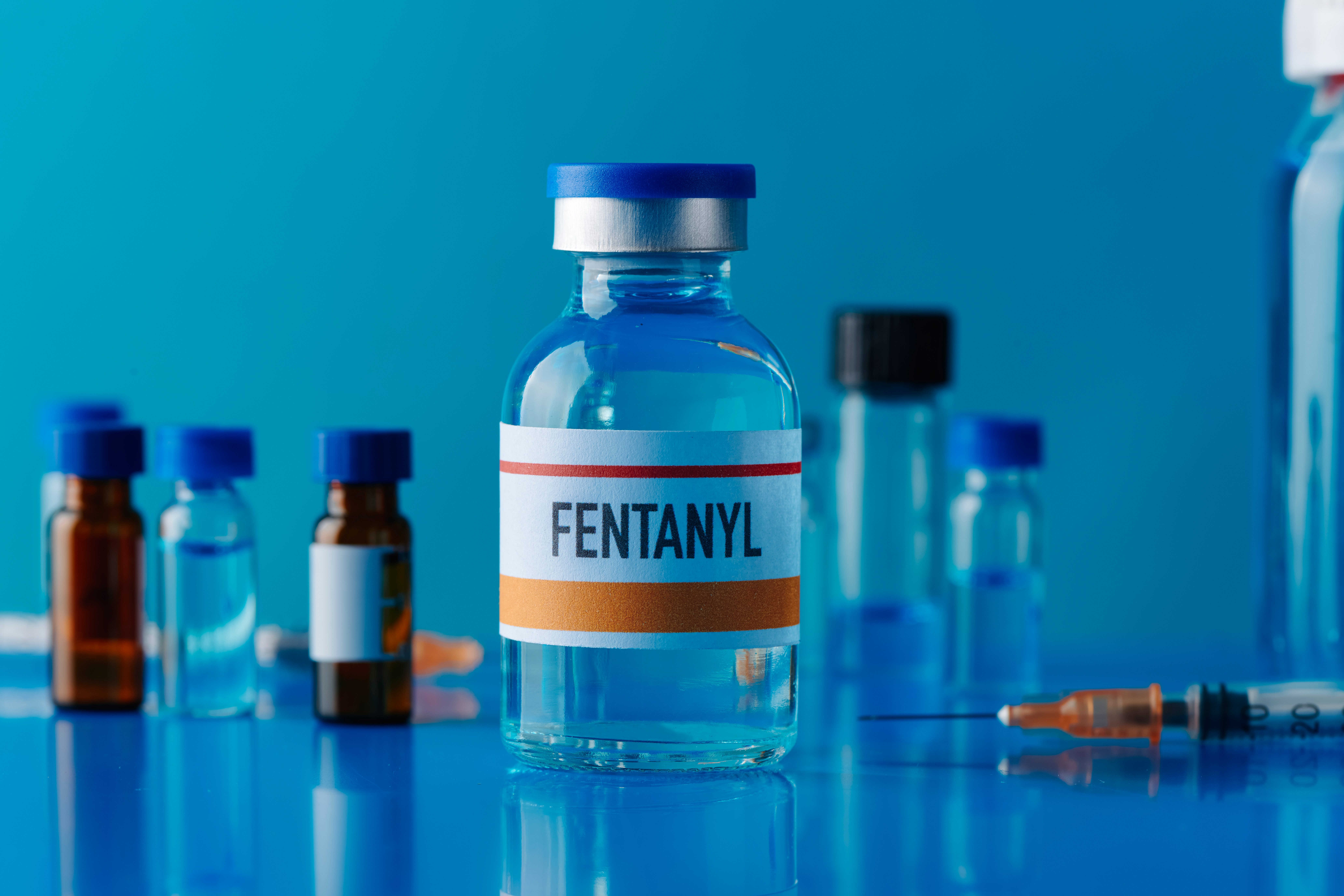 simulated vial of fentanyl and the effects of fentanyl on the Body