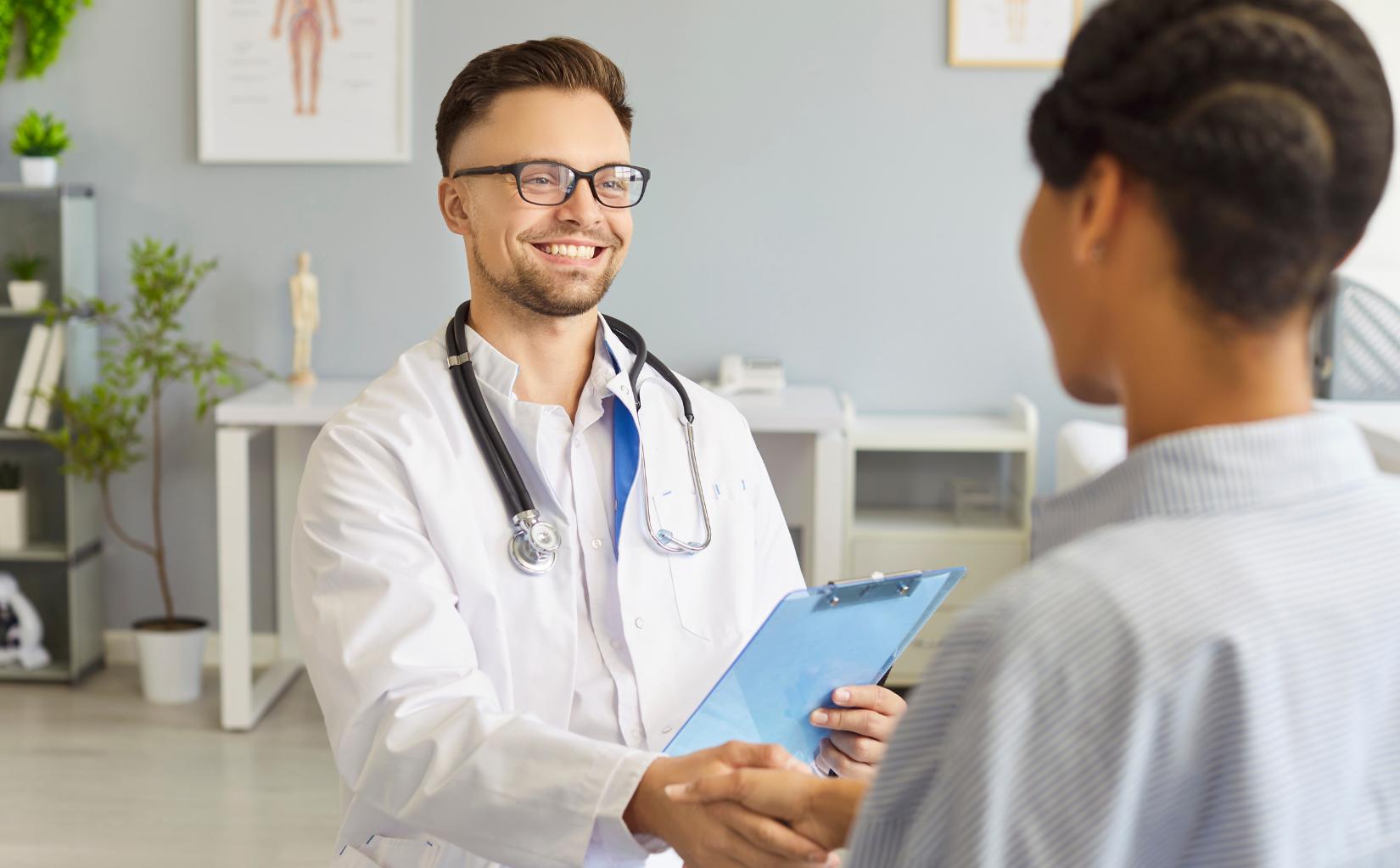 Physician welcoming a patient for prescription drug addiction treatment in Colorado Springs.