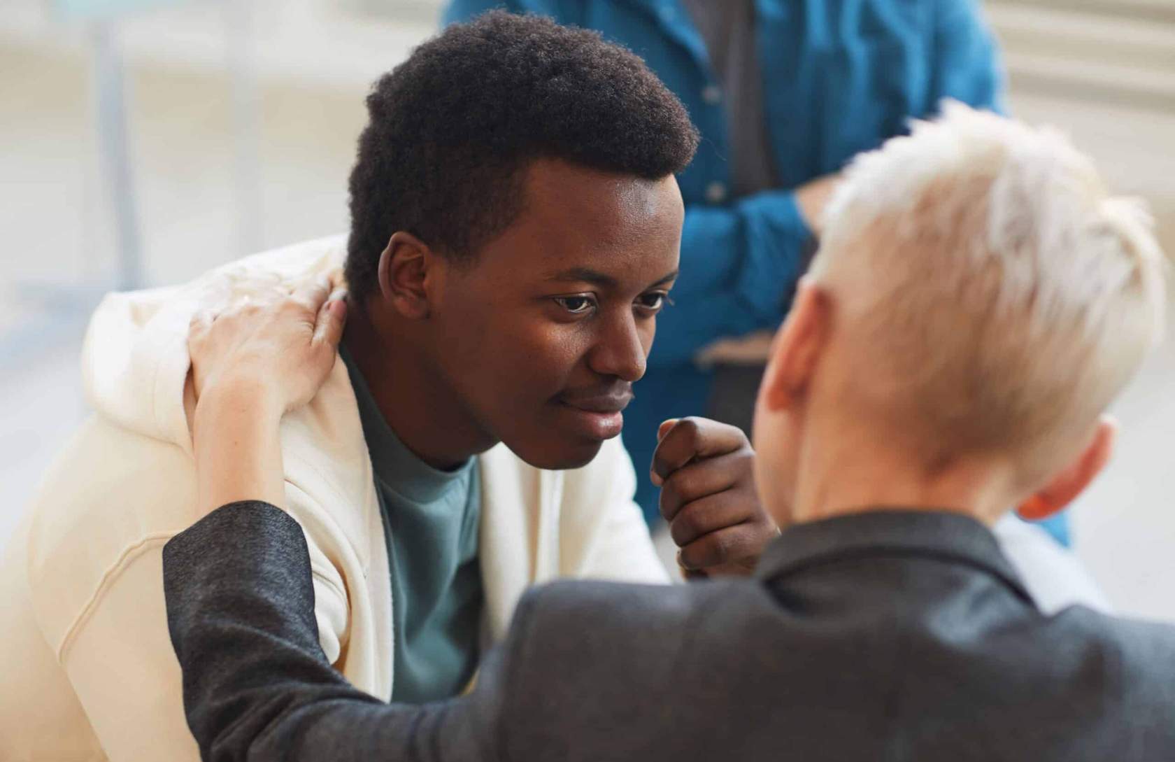 Man receiving guidance from a therapist during bipolar disorder treatment in Colorado Springs.