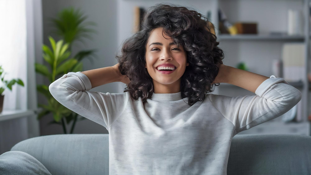 Smiling woman representing improved well-being after learning about types of anxiety disorders at Drift Behavioral Health.