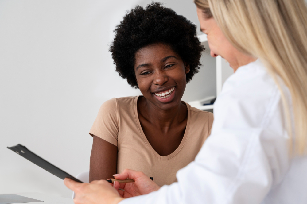 Smiling doctor and patient discussing recovery during oxycodone addiction treatment in Colorado Springs at Drift Behavioral Health.
